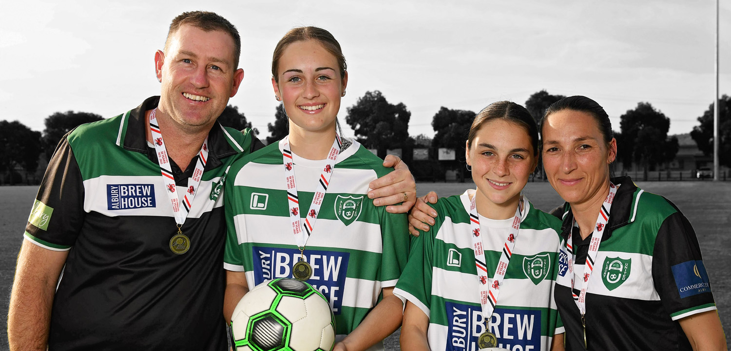 Cade Webb, Isabella Webb, Kyanna Milne and Karen Rannie-Milne with their medals after winning the Division 1 cup final for Albury United.