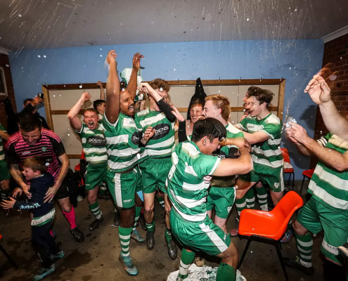 Party time in the visitors rooms at Savoy Park. Picture: JAMES WILTSHIRE