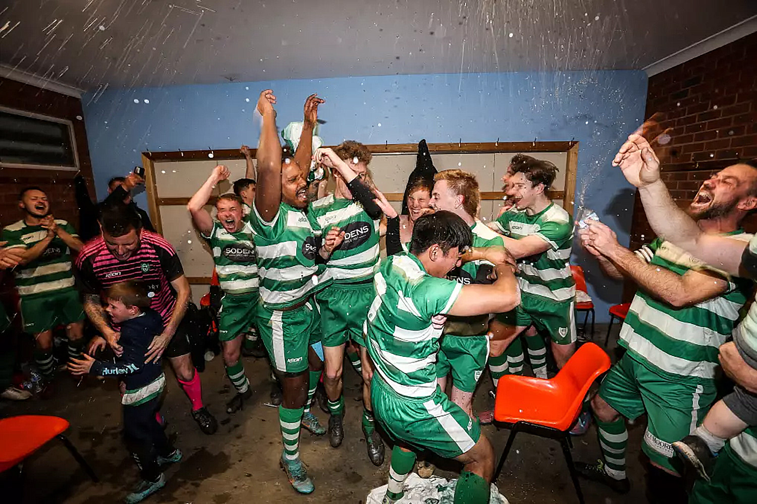 Party time in the visitors rooms at Savoy Park. Picture: JAMES WILTSHIRE